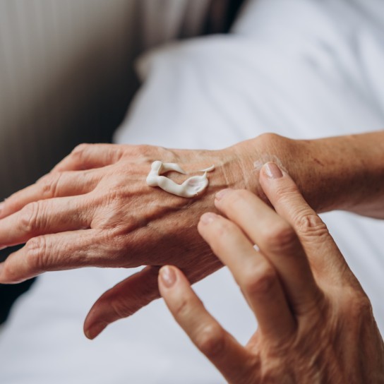 women senior takes care of herself
hand care

woman applying cream to her hands