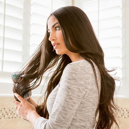 Woman brushing her hair