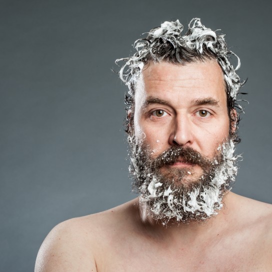 Portrait Of Shirtless Man Against Gray Background