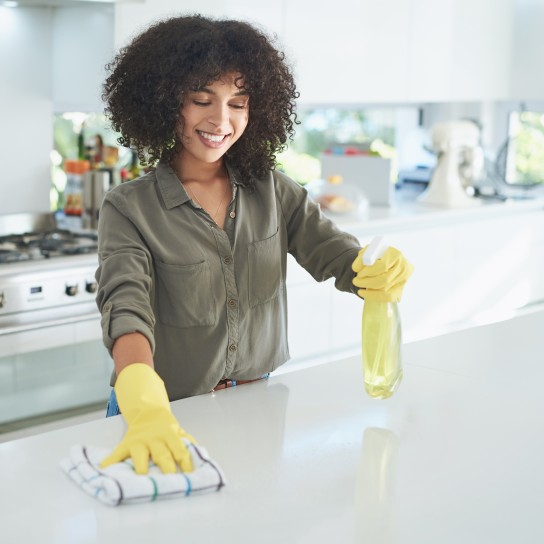 Shot of a young woman cleaning a kitchen counter at home
GettyImages-1163763269.jpg