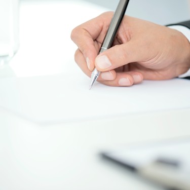 Man Signing Contract Paper