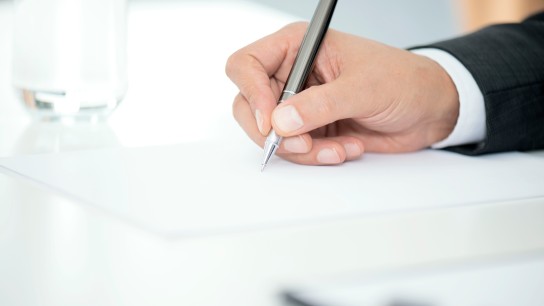 Man Signing Contract Paper