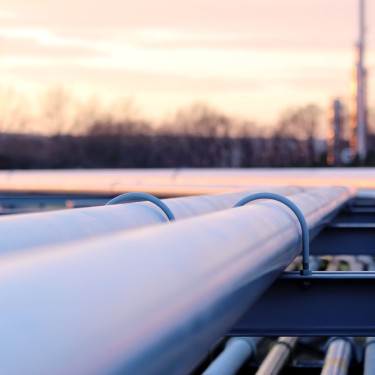 steel long pipe system in crude oil factory during sunset
GettyImages-640322960.jpg
