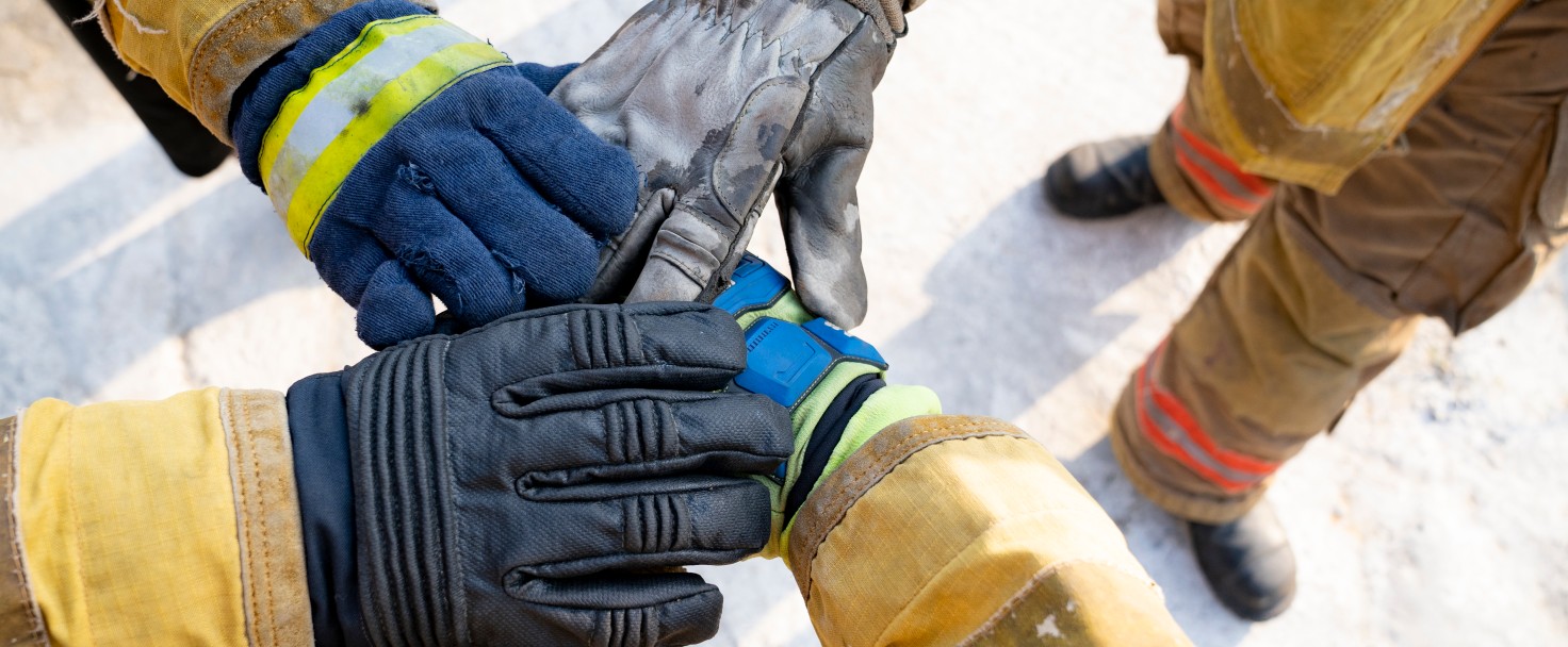 "We can, we will, we must. Members of the fire department clash hands for strong group before firefighting