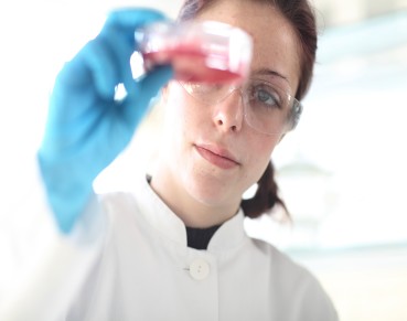 Young female scientist at work in lab