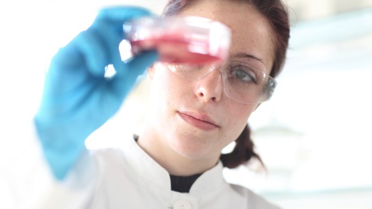 Young female scientist at work in lab