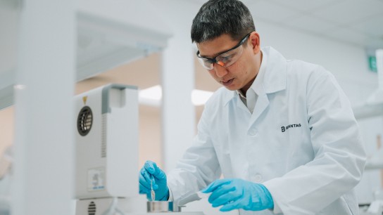Employee working with the laboratory devices, Singapore