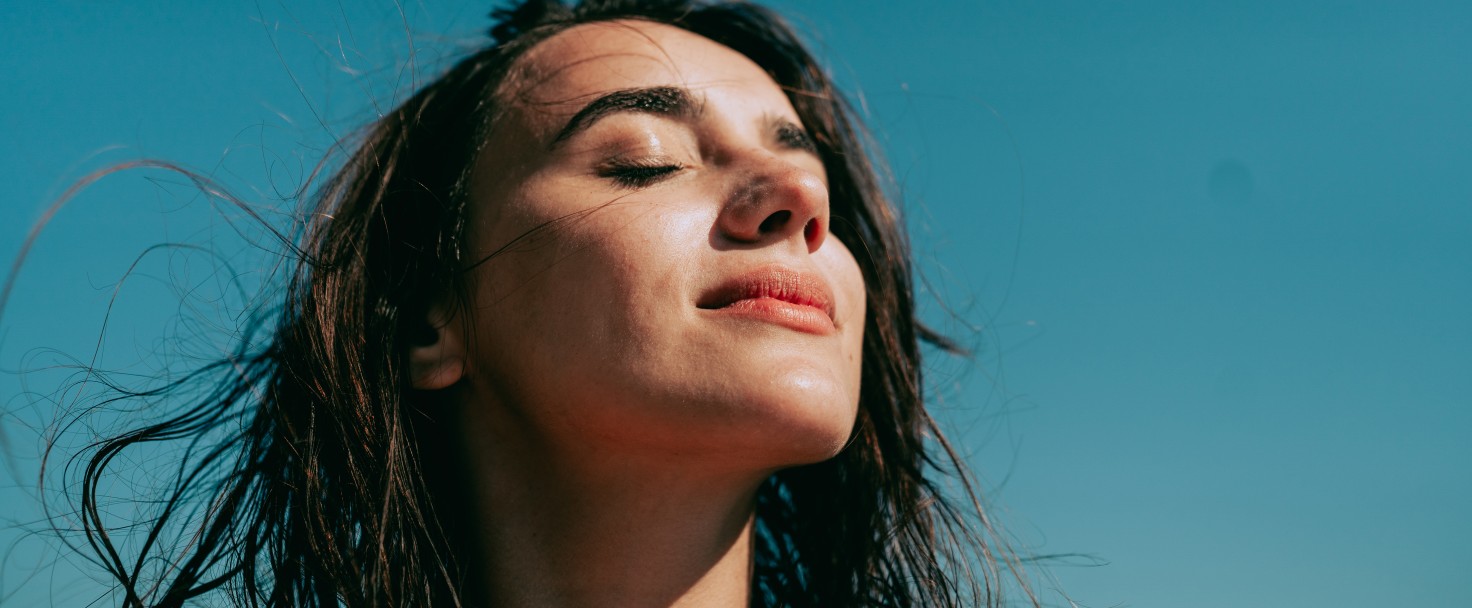 Self-portrait photo of a young woman at the beach.
GettyImages-1450268558.jpg