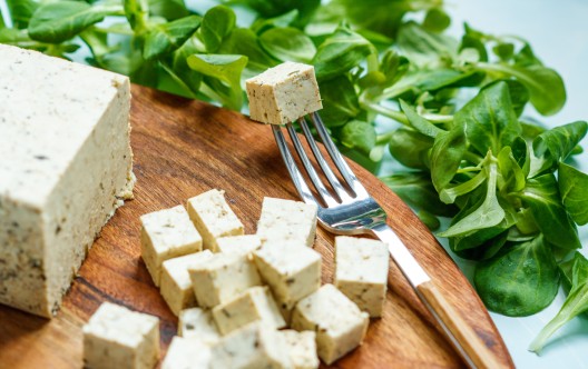 Tofu sliced on a wooden board. Love for a healthy vegan food concept
GettyImages-684819832.jpg