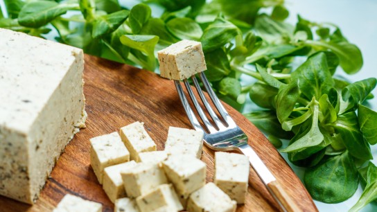 Tofu sliced on a wooden board. Love for a healthy vegan food concept
GettyImages-684819832.jpg