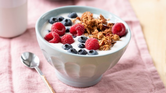 Yogurt with granola and berries in bowl